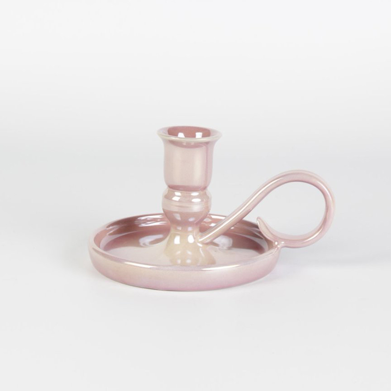 How are the colors and patterns of handmade ceramic candlesticks achieved?